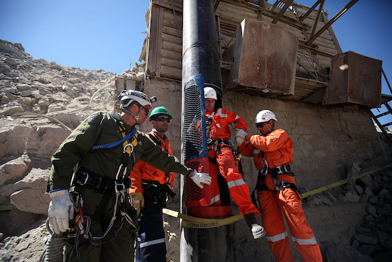 workers prepare rescue capsule